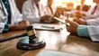 © OMGAi - Medical Team in Conference Room with Gavel. A group of medical professionals in a conference room, engaged in discussion with a focus on a gavel, symbolizing medical law and ethics.