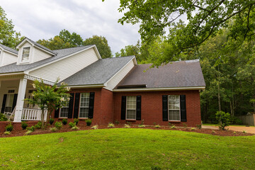 New roof and old roof on house, showing comparison of the two.