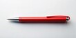 © Adisorn - A solitary bright red pen lies horizontally on a pristine white background, its bold color and sleek design popping against the clean, minimalist surroundings.