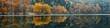 © Da - Reflection on the lake surface: The calm lake surface reflects an autumn scenery. The lake water is crystal clear and the reflection is clearly visible. Natural seasonal changes, generated by AI, high