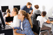 © JackF - Teenager girls and boys studying in computer lab during lesson.