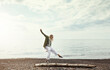 © ReeseArcurs/peopleimages.com - Balance, beach and woman walking on log outdoor in summer for hobby, leisure or vacation. Earth, freedom and sky with person having fun by ocean for break or fresh air, holiday and weekend trip
