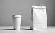 © Dmitriy - White paper cup and bag mockup on a white table