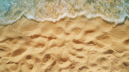 Wall Mural - Texture of sand on a beach seen from above