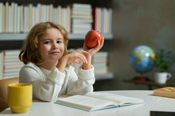 Aufkleber - Elementary school boy. Child at school. Schoolboy reading book in library. Kids development. Pupil learn to read. Child from elementary school read books in a book store.