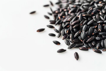Wall Mural - A pile of black rice sits on a clean white table, perfect for food photography or culinary-themed designs