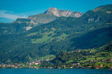 Wall Mural - Switzerland landscape. Village on Lake in Switzerland. Mountain scenery in the Alps . Switzerland Alps. Landscape of touristic alpine village. Switzerland Mountain panorama.