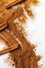 Poster - Cinnamon powder and sticks on a white background