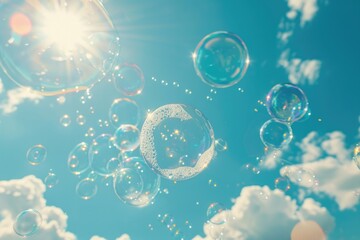 Wall Mural - Soap bubbles fly against the blue sky on a sunny day