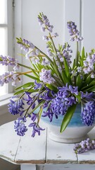 Gentle muscari and hyacinth first spring flowers in vase