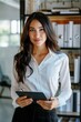 © id512 - beautiful business woman holding tablet computer in modern office