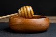 © rsooll - natural liquid honey in a wooden bowl