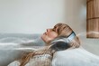 © Rawpixel.com - Woman listening to music at home during coronavirus pandemic