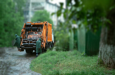 Garbage collection using garbage trucks. Highlighting the role of garbage trucks in sustainable urban development and the impact of effective waste management on the environment and public health.