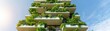 © Chanoknan - Modern building with lush greenery on balconies against blue sky, showcasing sustainable architecture and environmental design.