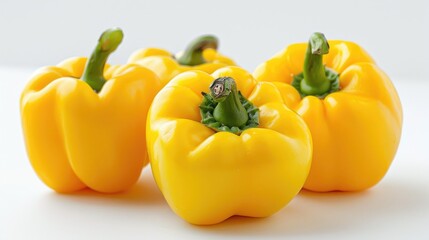 Yellow bell peppers isolated in a horizontal arrangement