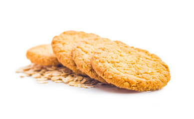 Poster - Tasty oatmeal cookies and rolled oat  isolated on white background.