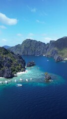 Wall Mural - Aerial footage of the boats moored off the shore of Shimizu Island in El Nido, Palawan, Philippines