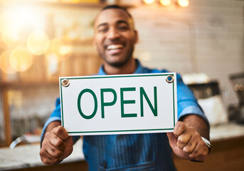 Canvas Print - Coffee shop, open sign and portrait of man in cafe for small business, startup and retail store. Restaurant, cafeteria and happy waitress, barista and owner by counter for service, help and welcome