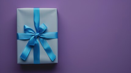 A rectangular gift box with a blue ribbon on a solid purple background.