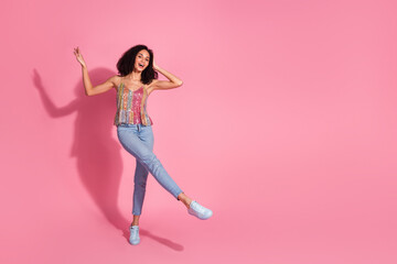 Wall Mural - Full body photo of attractive young woman dance have fun dressed stylish sequins clothes isolated on pink color background