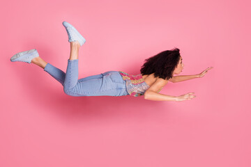 Sticker - Full length photo of lovely young lady flying levitation dressed stylish sequins garment isolated on pink color background