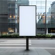 © Tackey - Blank vertical billboard in city setting, perfect for advertisement mockups and design presentations for urban environments.