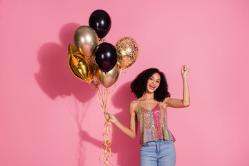 Poster - Photo portrait of pretty young girl hold air balloons winning wear trendy sequins outfit isolated on pink color background