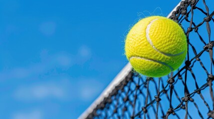 Poster - A tennis ball flies over the net on a sunny day with blue skies and white clouds