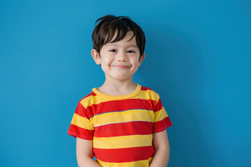 Wall Mural - happy and black hair Boy stripes red and yellow T-shirt, blue background