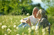 © aletia2011 - Portrait of senior couple sitting on the grass in the park