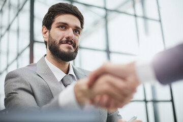 Wall Mural - Two diverse professional business men executive leaders shaking hands at office meeting