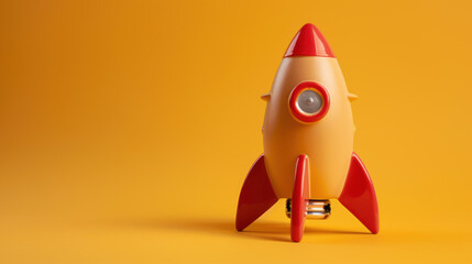 a yellow and red rocket is sitting on a yellow background