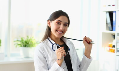 Wall Mural - Beautiful smiling female doctor at workplace portrait. Physical and disease prevention patient aid exam visit 911 ward round prescribe remedy healthy lifestyle consultant profession concept