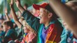 © Sittipol  - The photo shows a group of children sitting in a stadium and cheering.