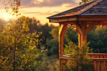 Wall Mural - Wooden gazebo with tree at golden hour in front of woods