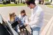 © puhhha - Family Charging Electric Car Outdoors, Parents And Child Adding Power To Eco-Friendly Vehicle