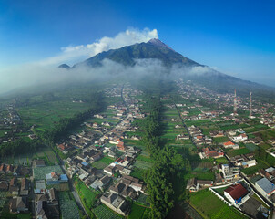 Sticker - the magnificent Merapi Volcano in Java Island, Indonesia. Merapi Volcano is one of the most active volcano in the world. 