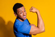 © deagreez - Photo portrait of attractive young man show biceps boast dressed stylish blue clothes isolated on yellow color background
