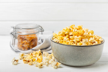 Wall Mural - Tasty popcorn on wooden background. Cinema and entertainment concept. Movie night with popcorn.Cheese and caramel popcorn. Delicious appetizer, snack. Place for text. Copy space.Banner