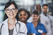© peopleimages.com - Portrait, happy people or proud doctors with teamwork in hospital for healthcare services or about us. Nursing leadership, medical professional and nurses with confidence or trust at wellness clinic