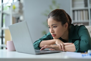 Poster - Stressed asian businesswoman working on laptop at home, feeling overwhelmed and fatigued from overwork, deadlines, and technology frustration