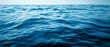 © Nasim - Blue sea water background ,Close up of water surface with ripples , Abstract background and texture for design ,beautiful blue waves water background