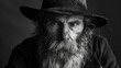 © furyon - dramatic black and white portrait of a rugged man with a full beard and weathered hat high contrast lighting emphasizes texture and character evoking a sense of wisdom and life experience