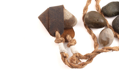 Poster - Antique Sling Shot and Stones on a White Background from the Story of David and Goliath in the Bible
