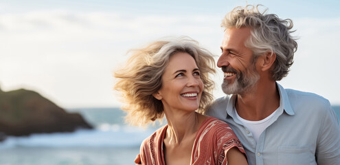 Poster - Summer portrait happy smiling mature couple together on sunny coast, enjoying beach vacation at sea