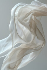 Poster - Close-up of a sheer, light fabric drifting softly in mid-air on a minimalist white background,