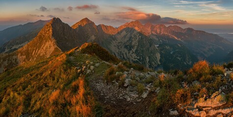 Wall Mural - Wonderful panorama mountains with a hiking trail on the ridge. Picturesque places in Tatra Mountains in Poland. View on mountain ridge (Volovec Wolowiec) in Western Tatras. 