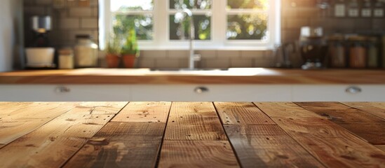 Wall Mural - Wooden table top on a blurred kitchen counter background for showcasing products or designing visual layouts.