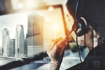 Urban, call center agent and woman with headset, double exposure and hand is office for telemarketing. Consultant, service and crm for helpline or support, female person and employee in New York city